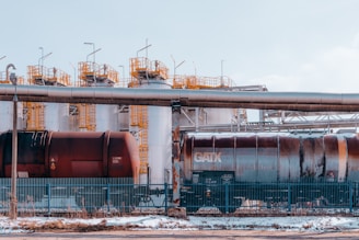 a train on a train track next to a building