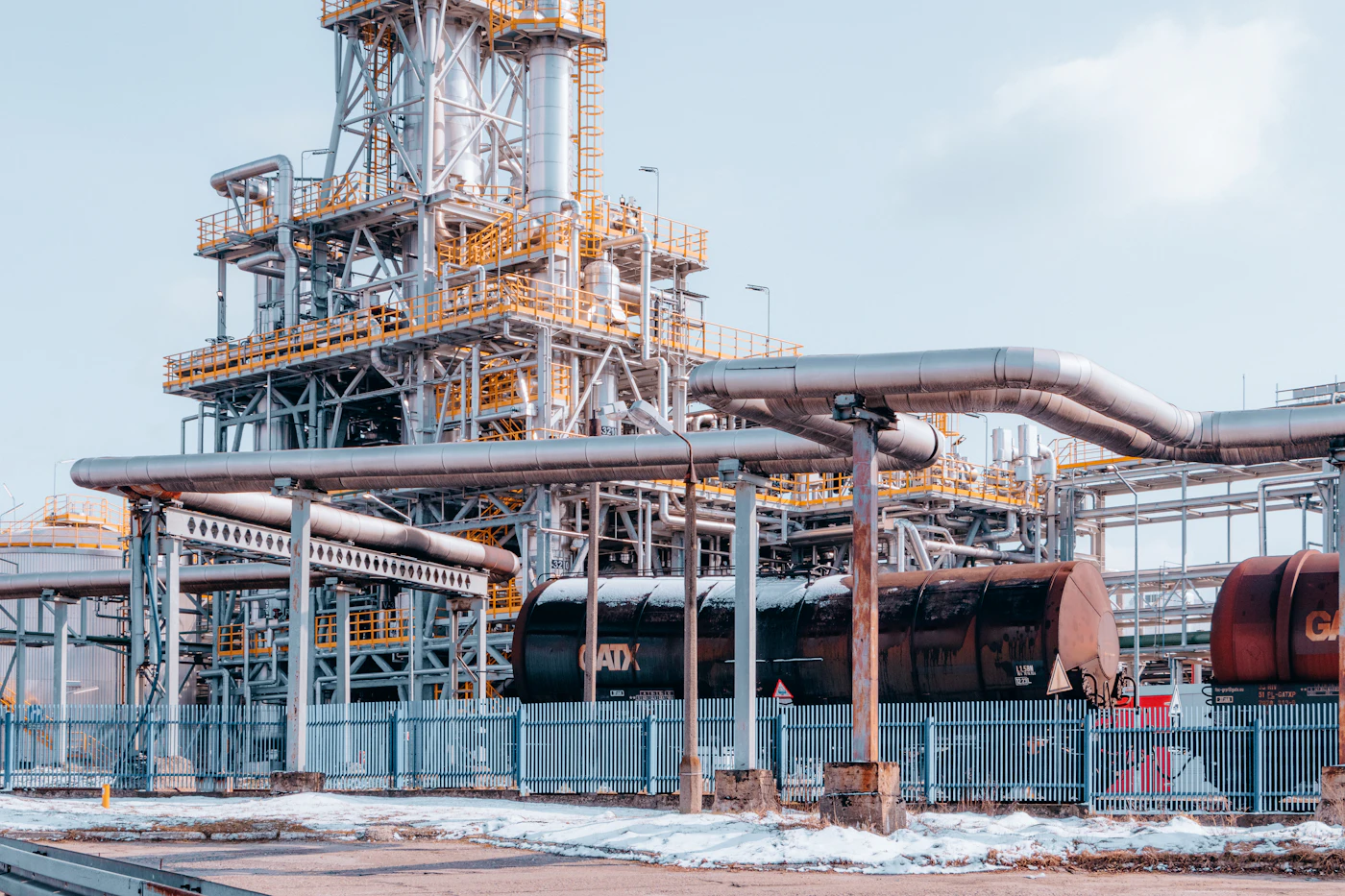 Refinery process plant with towers, pipework and access platforms