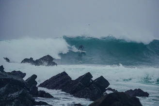 Surfer catching a wave at the famous 'Derechón' spot on Lobos Island.