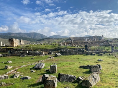 A mythical landscape with a vibrant sky and ancient ruins.