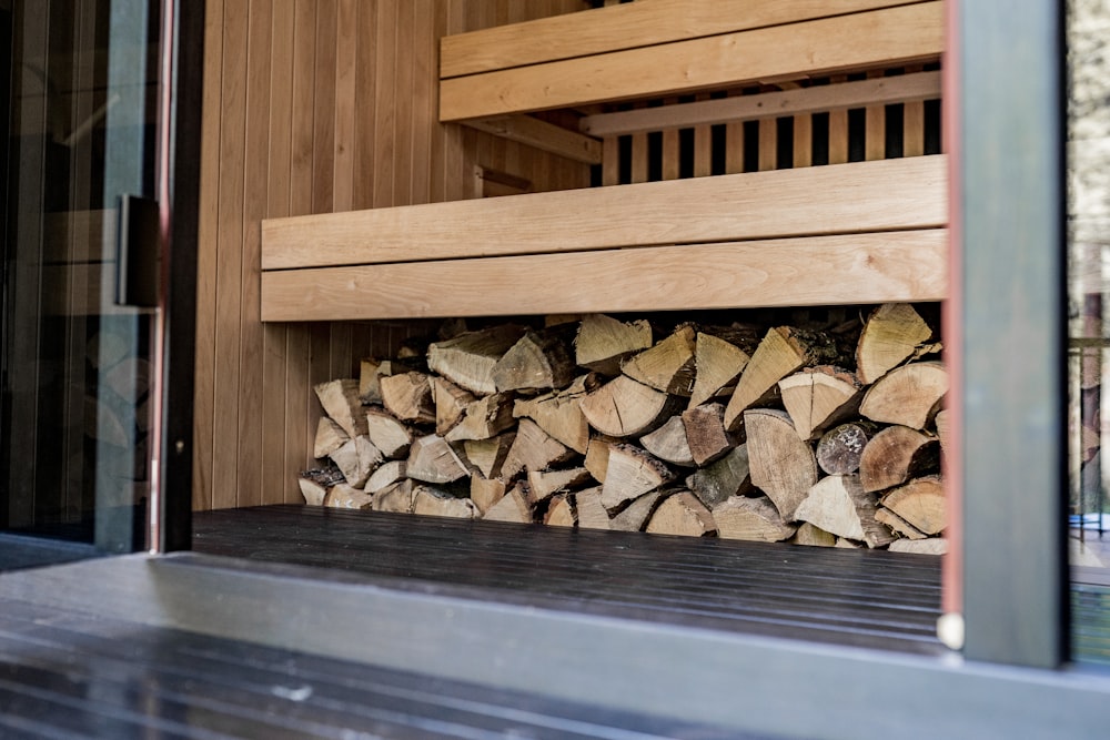 a stack of wood sitting on top of a wooden floor