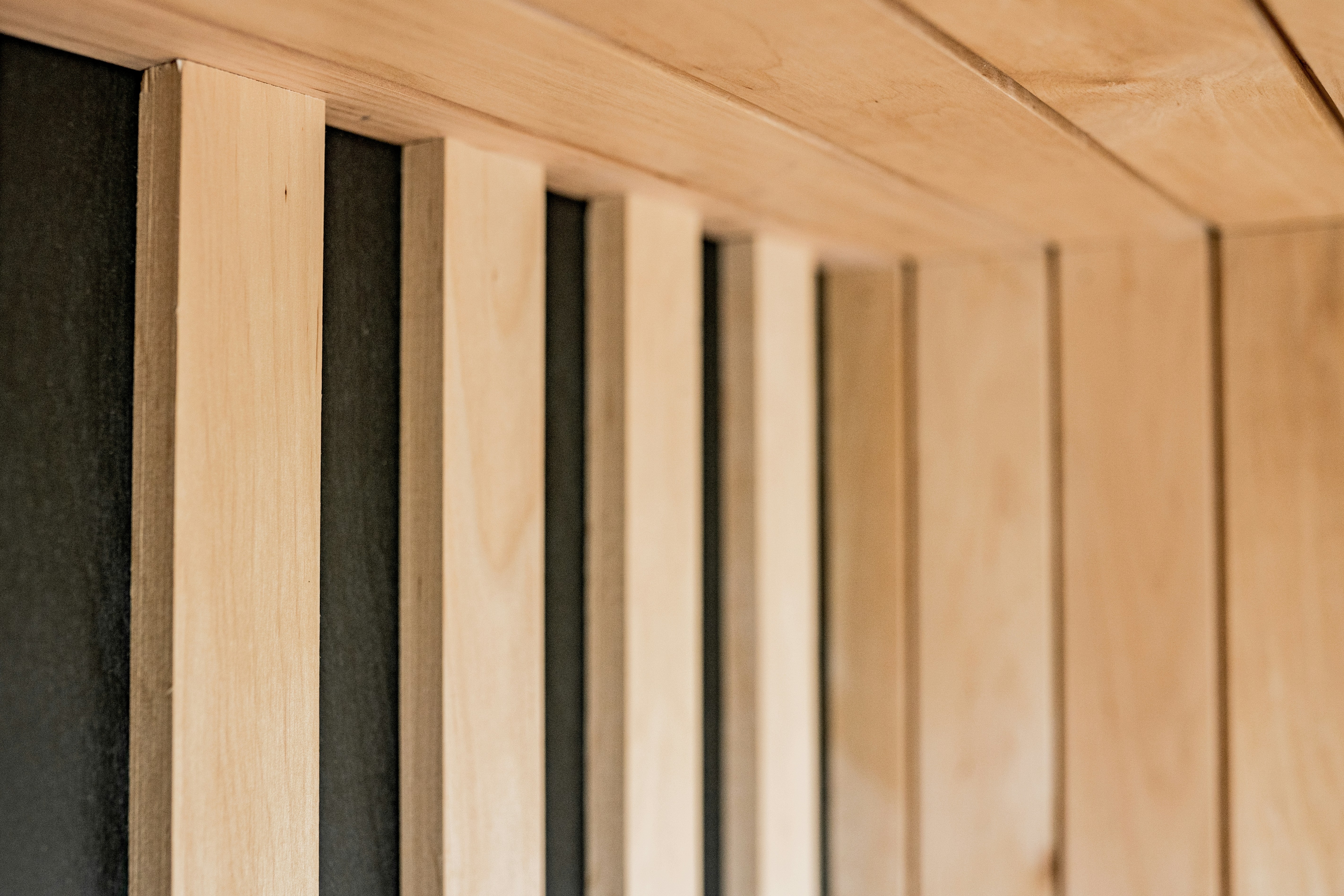 A row of wooden boards lined up against a wall photo Free Banská