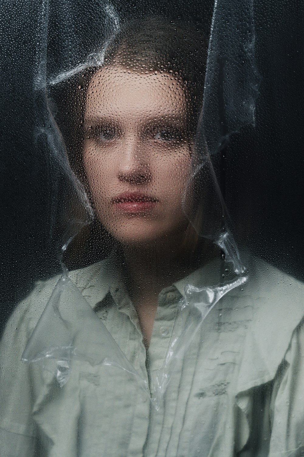 a woman with a plastic covering her head