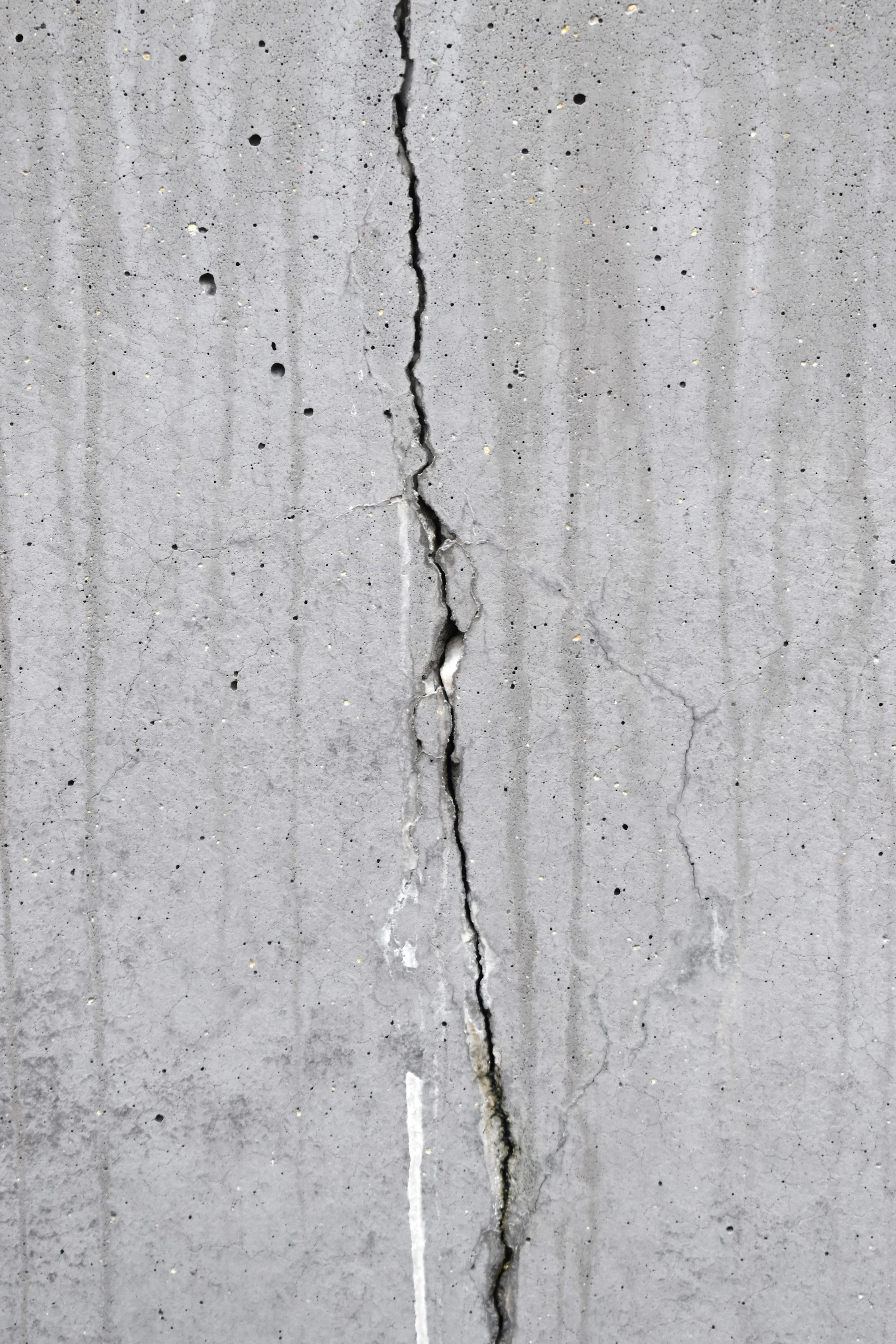 a crack in the concrete of a building