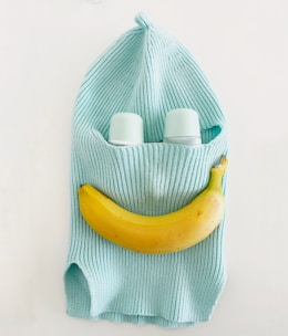 A whimsical display of prank items including a potato with googly eyes and a banana with a smiley face.