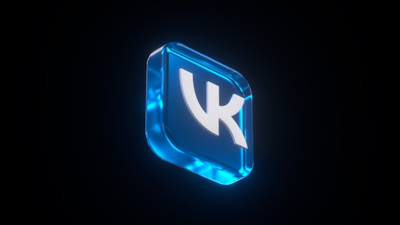A glowing blue, 3D icon featuring a stylized letter 'K' set against a dark background, giving a modern and sleek appearance.