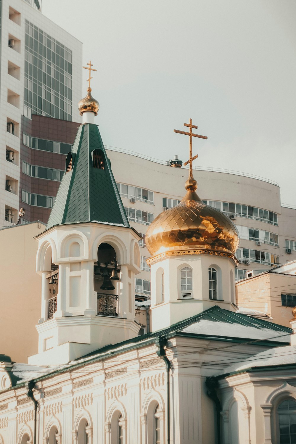 a church with a gold dome and a cross on top