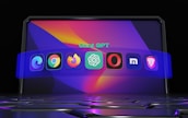 A futuristic digital display featuring various popular web browser icons. The icons are arranged in a semi-circle on a vibrant, abstract background with a keyboard surface below them. The text 'Chat GPT' is displayed above the icons.