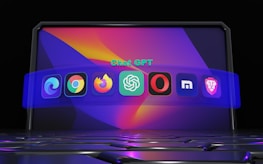 A futuristic digital display featuring various popular web browser icons. The icons are arranged in a semi-circle on a vibrant, abstract background with a keyboard surface below them. The text 'Chat GPT' is displayed above the icons.