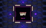 A digital rendering of an electronic circuit board, with a central black chip featuring the text 'CHAT GPT' and 'Open AI' in gradient colors. The background consists of a pattern of interconnected triangular plates, illuminated with a blue and purple glow, adding a futuristic feel.
