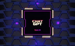 A digital rendering of an electronic circuit board, with a central black chip featuring the text 'CHAT GPT' and 'Open AI' in gradient colors. The background consists of a pattern of interconnected triangular plates, illuminated with a blue and purple glow, adding a futuristic feel.