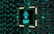 A stylized representation of a computer chip is integrated into a black and teal geometric background. The chip features a minimalist, futuristic face design along with the text 'CHAT GPT' in bold, glowing teal. The background consists of repeating black shapes outlined in teal, creating a high-tech, digital atmosphere.