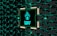 A stylized representation of a computer chip is integrated into a black and teal geometric background. The chip features a minimalist, futuristic face design along with the text 'CHAT GPT' in bold, glowing teal. The background consists of repeating black shapes outlined in teal, creating a high-tech, digital atmosphere.