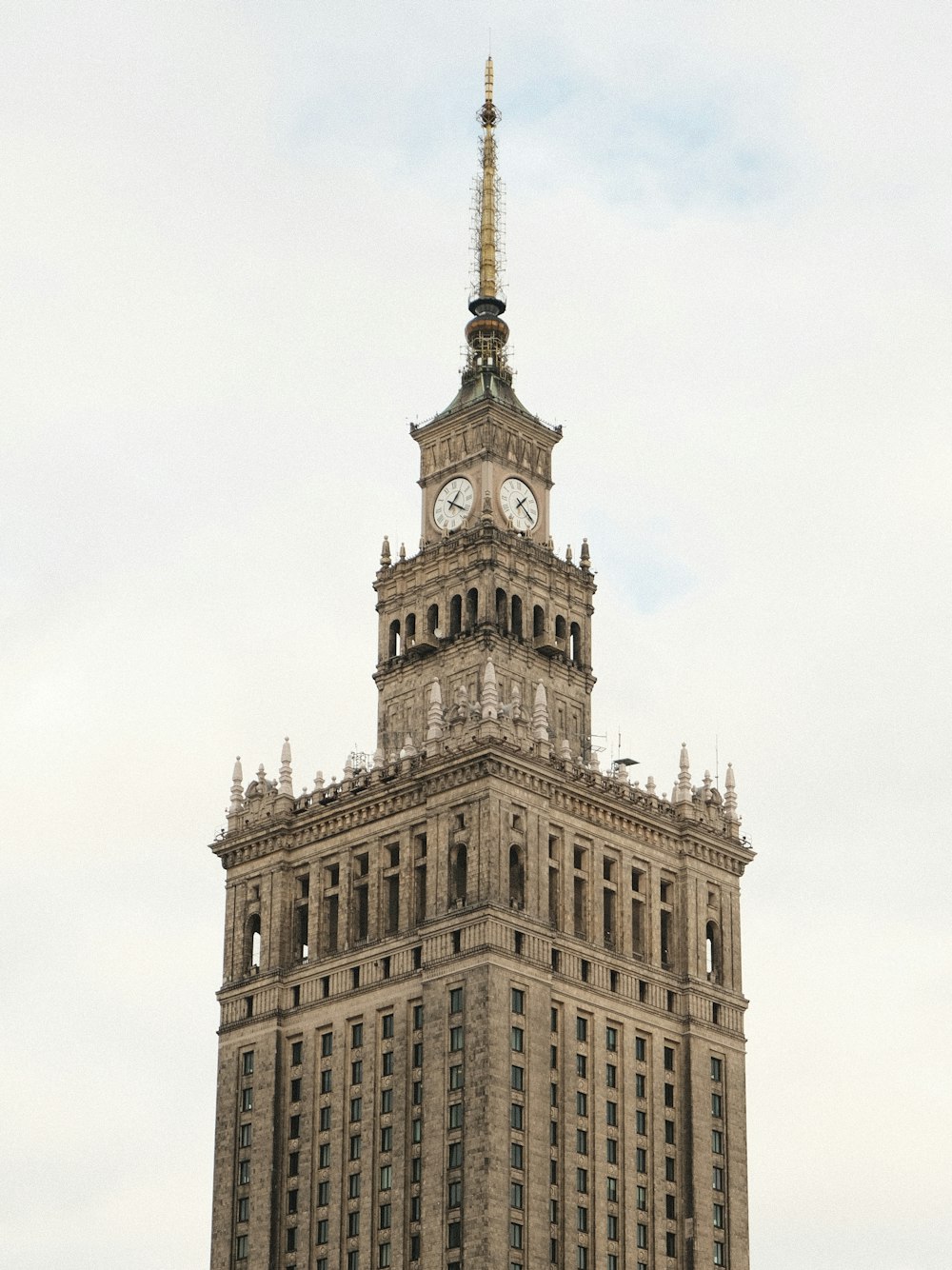 a tall building with a clock on the top of it