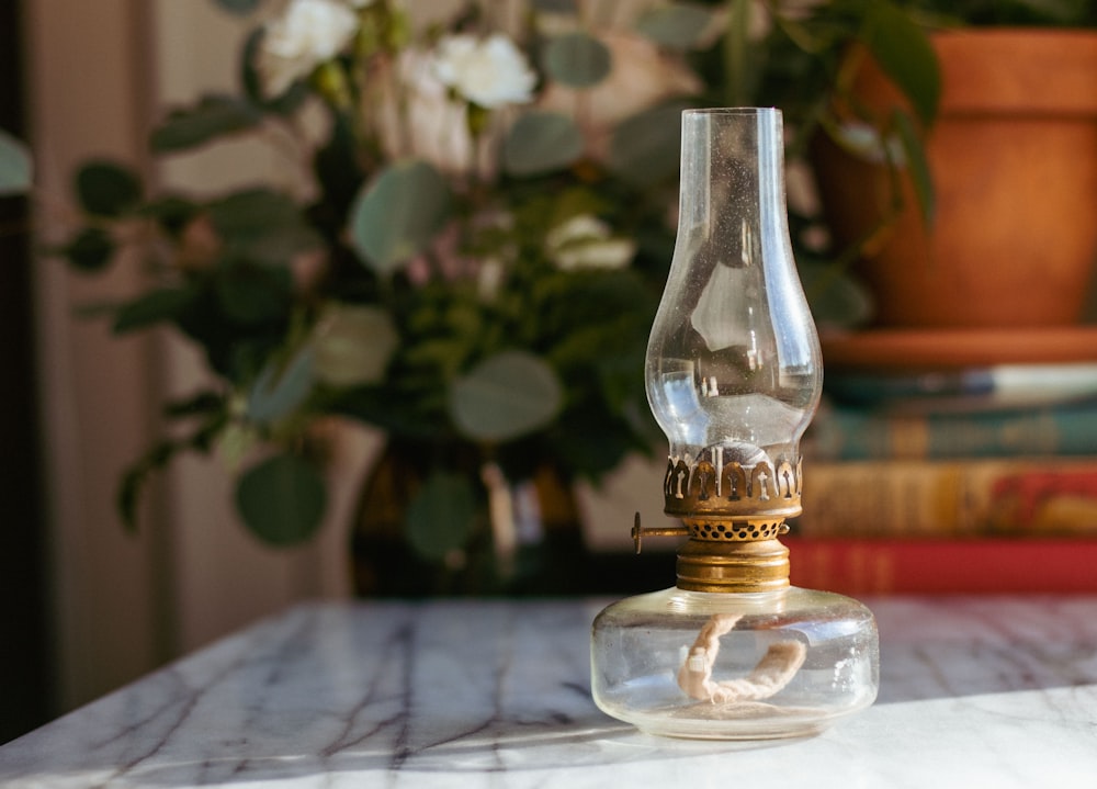 a glass bottle sitting on top of a table