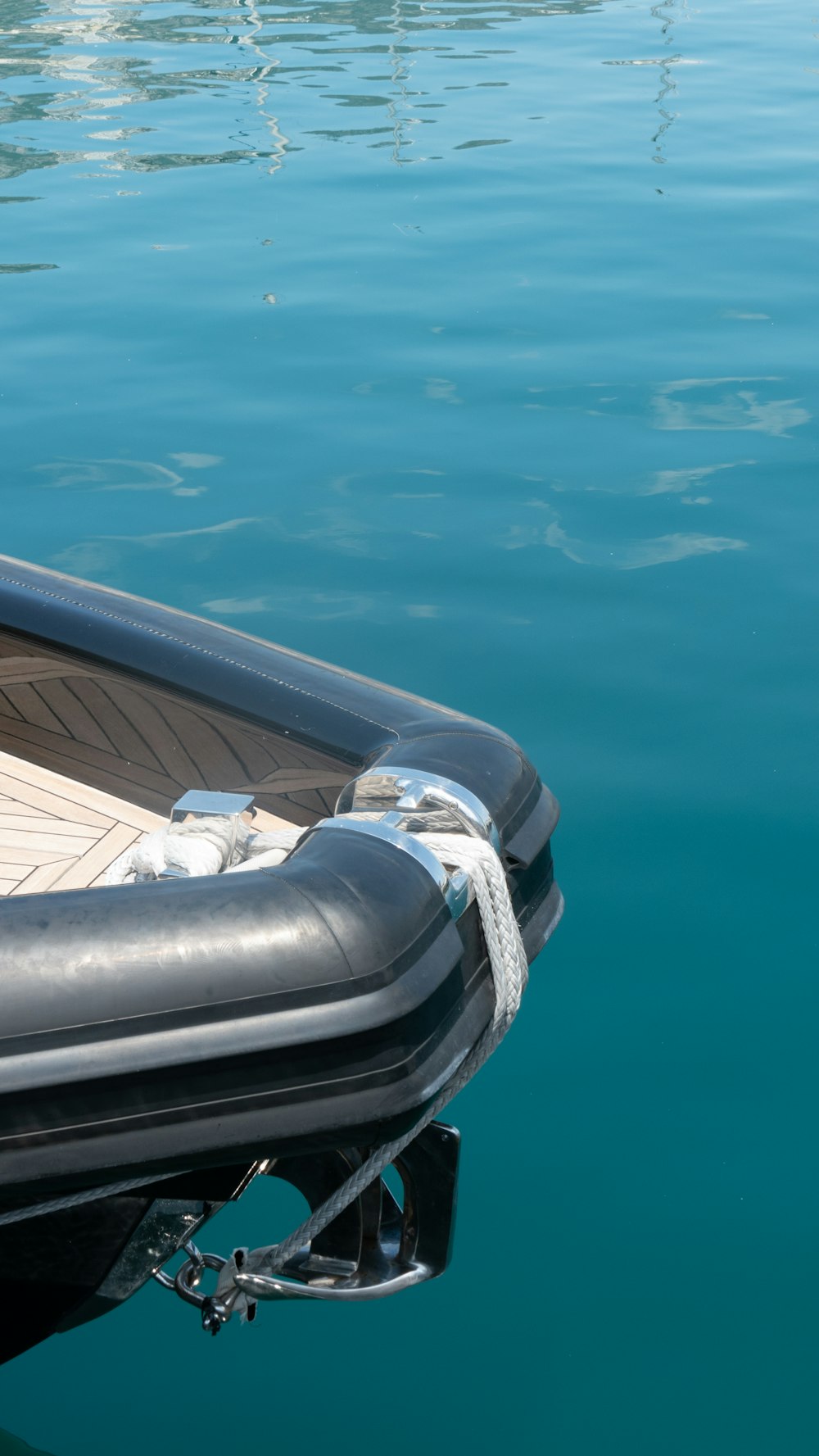 a small boat floating on top of a body of water