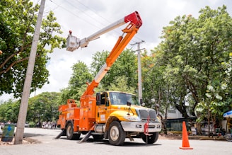 a utility truck with a crane on the back of it