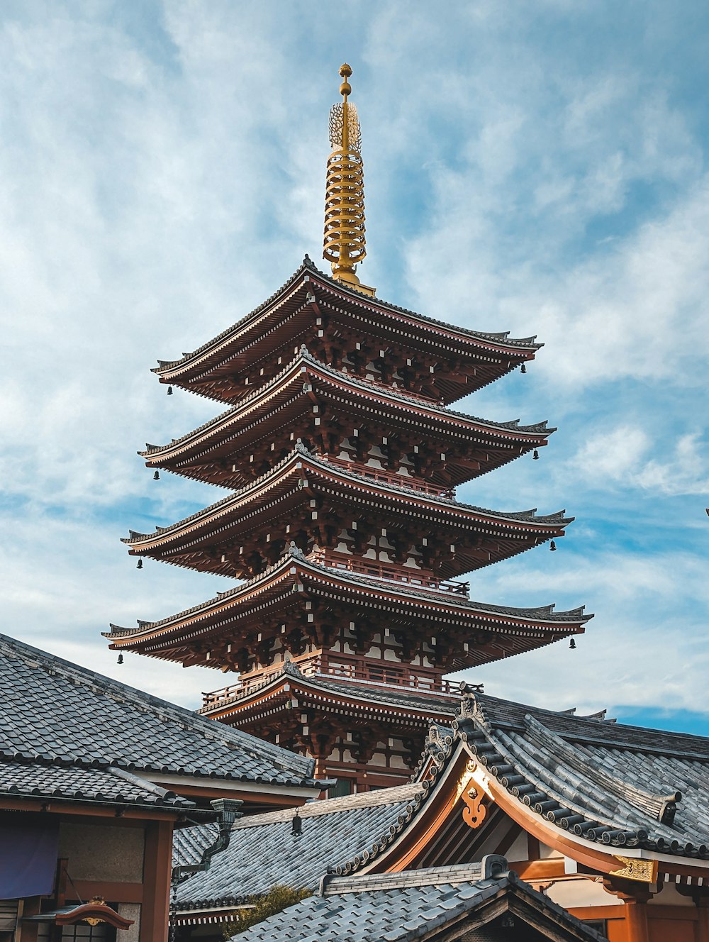 a tall building with a tower in the middle of it