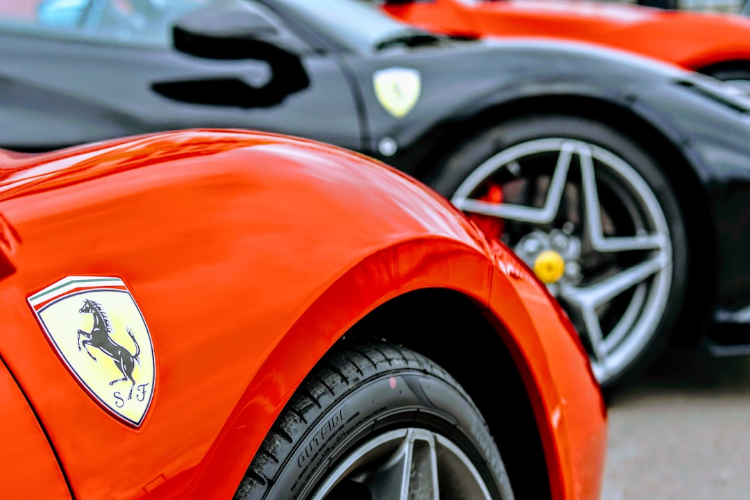 a row of sports cars parked next to each other,