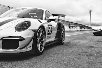 a black and white photo of a race car