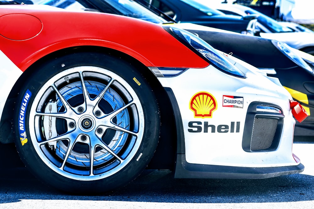 a close up of a red and white sports car