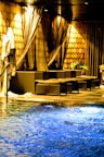 Elegant spa area featuring a warm indoor pool and relaxing lounge chairs.