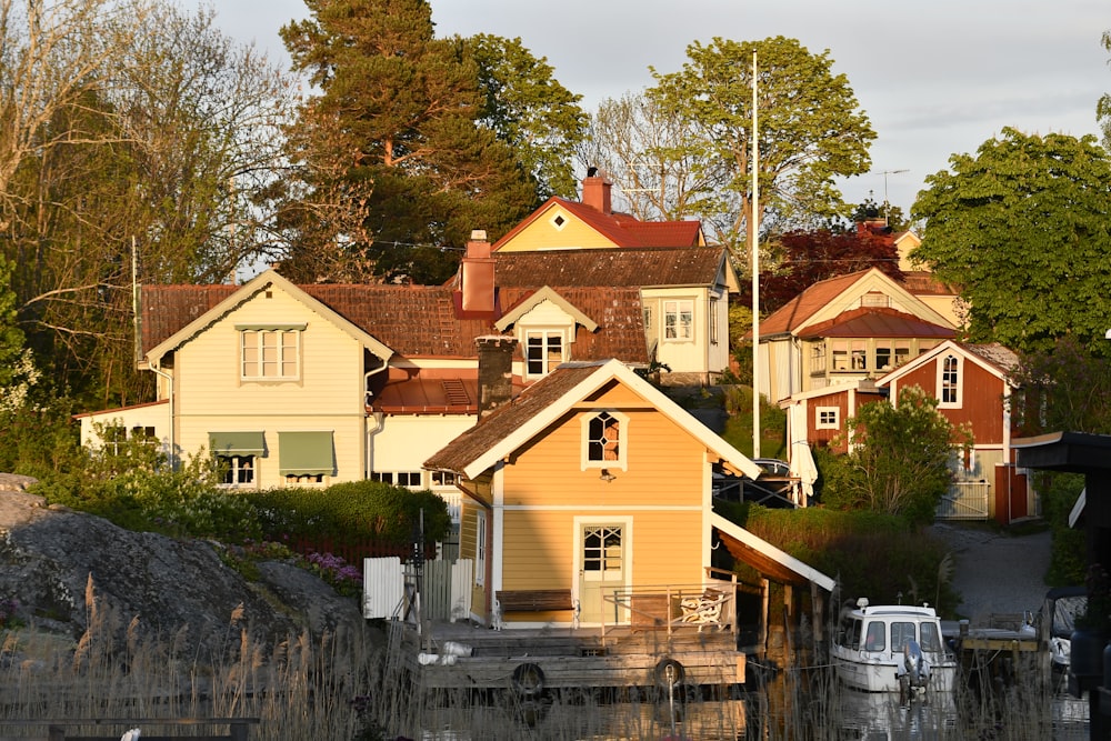 a row of houses next to a body of water