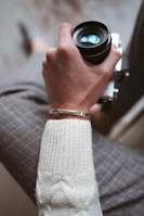 a person holding a camera in their hand