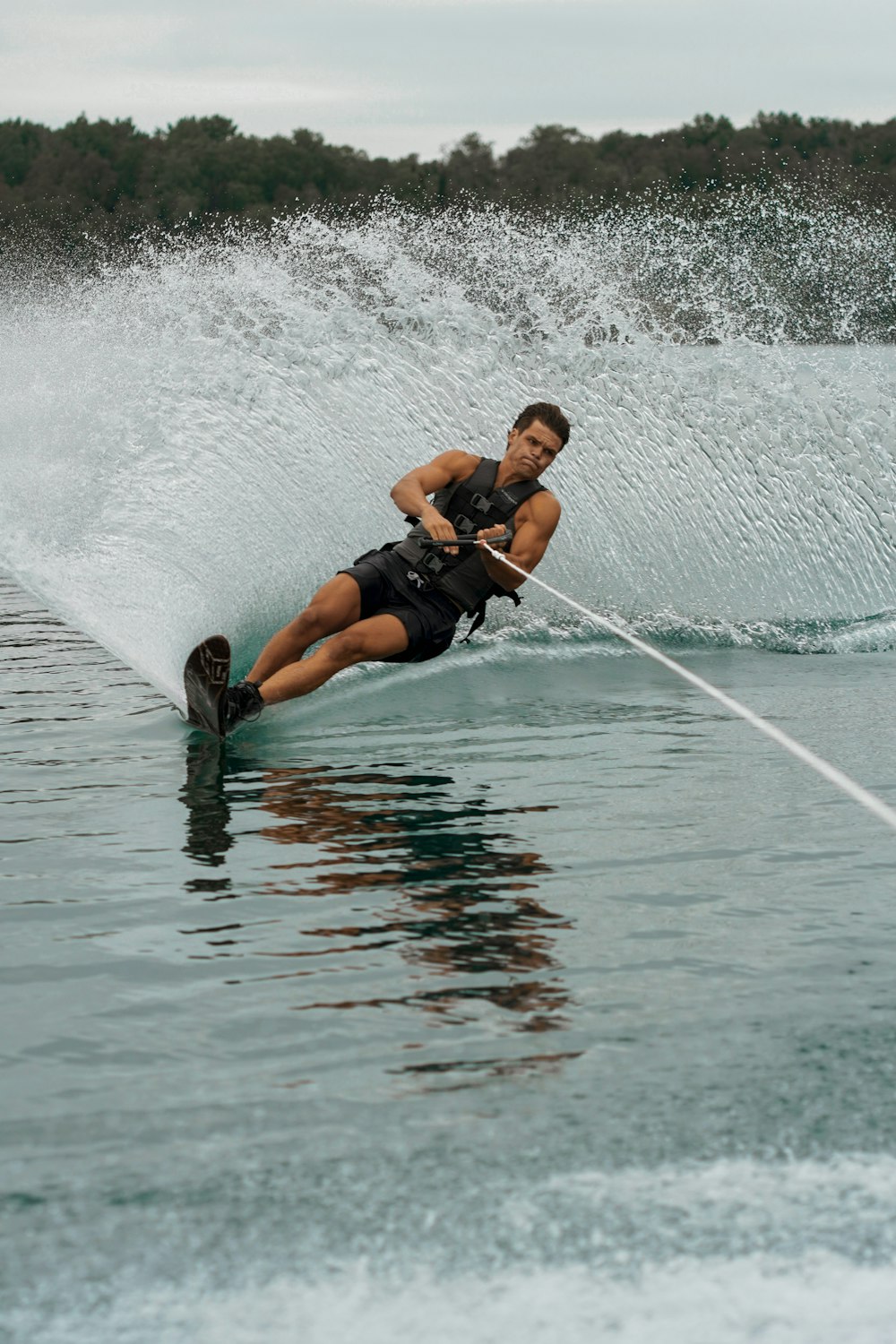 a man on a water ski being pulled by a boat