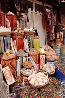 a table topped with lots of baskets filled with food