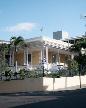 A charming single-family home with a lush garden in a quiet South Florida neighborhood.
