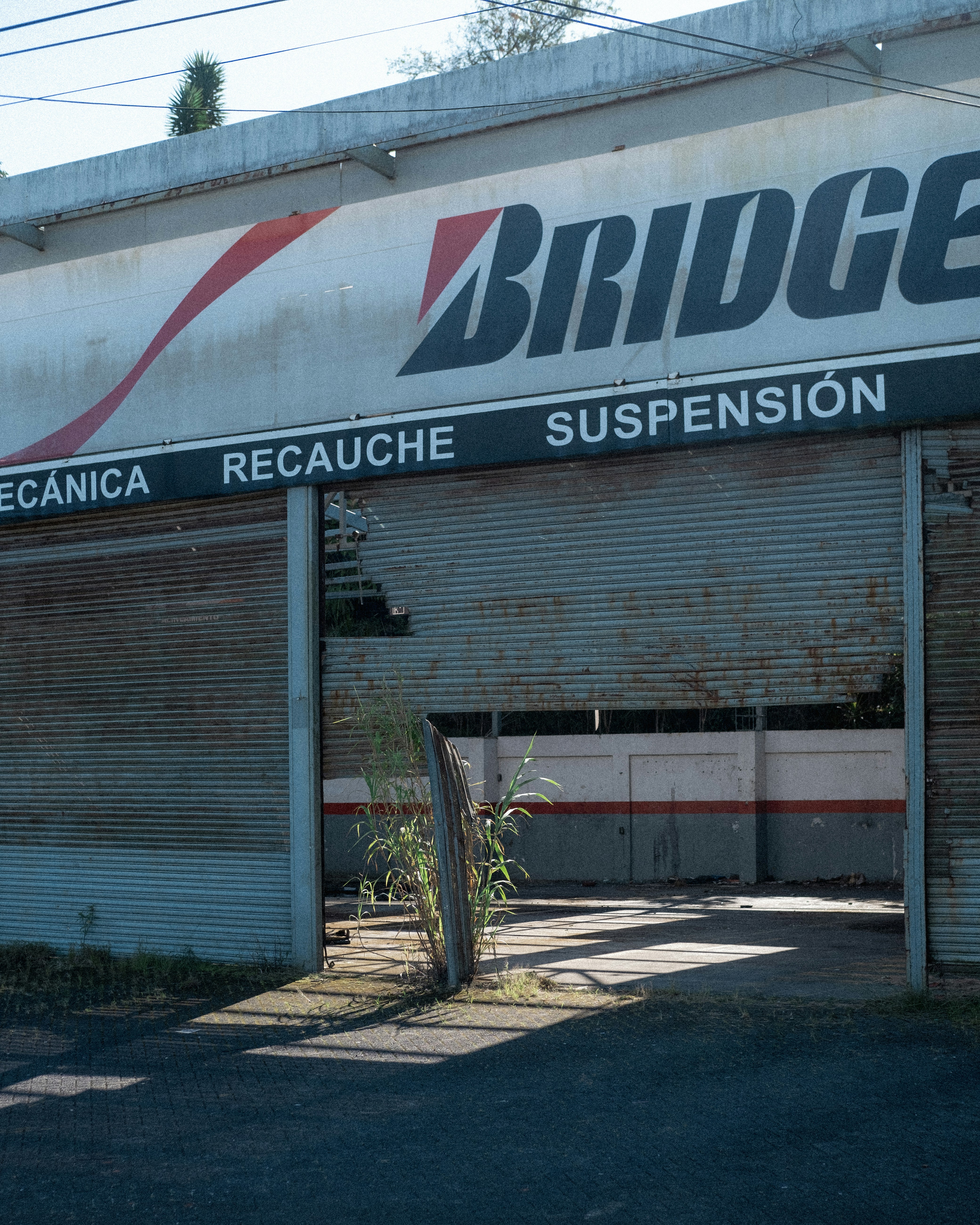 a run down building with a sign on the side of it