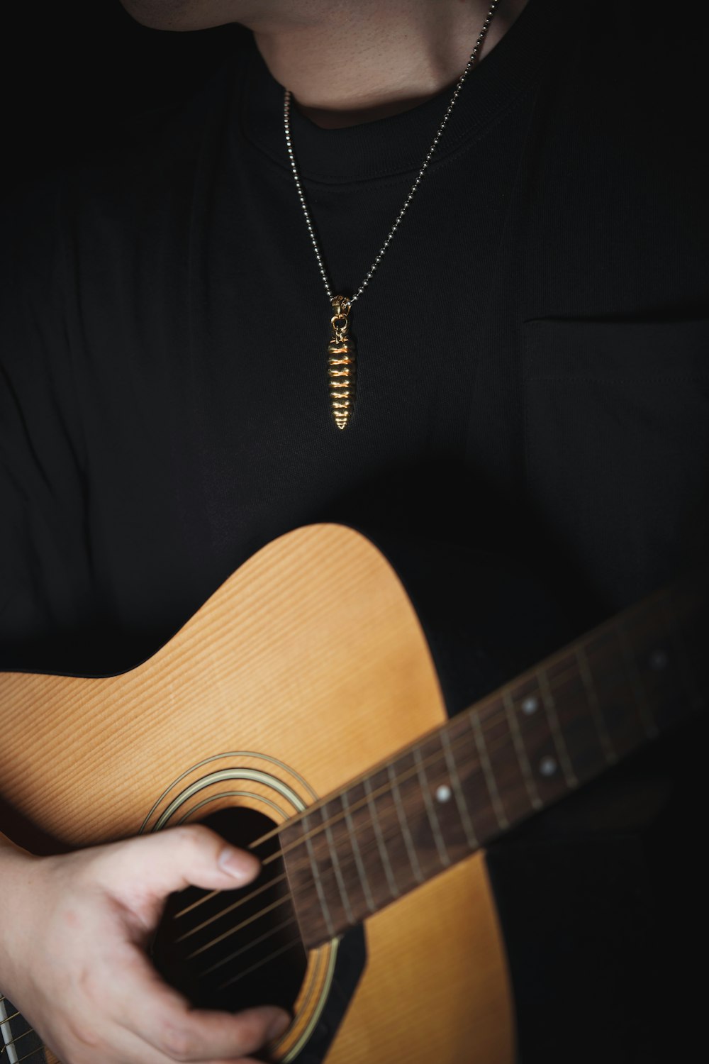 a man holding a guitar in his hands