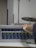 A sound engineer adjusting audio equipment in a modern studio environment.