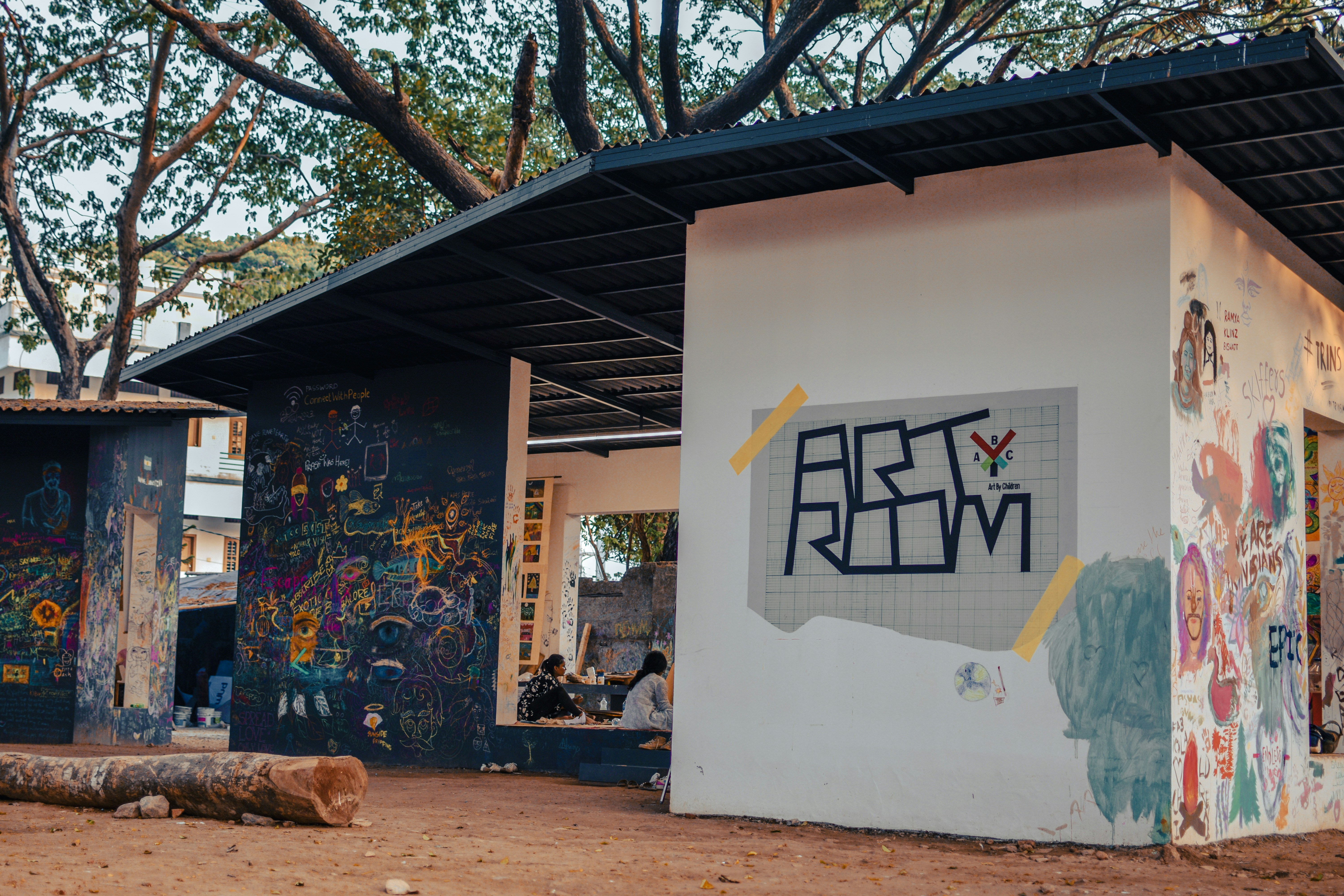 a white building with graffiti on the side of it