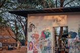 Colorful murals depicting social dialogue and cultural expression.