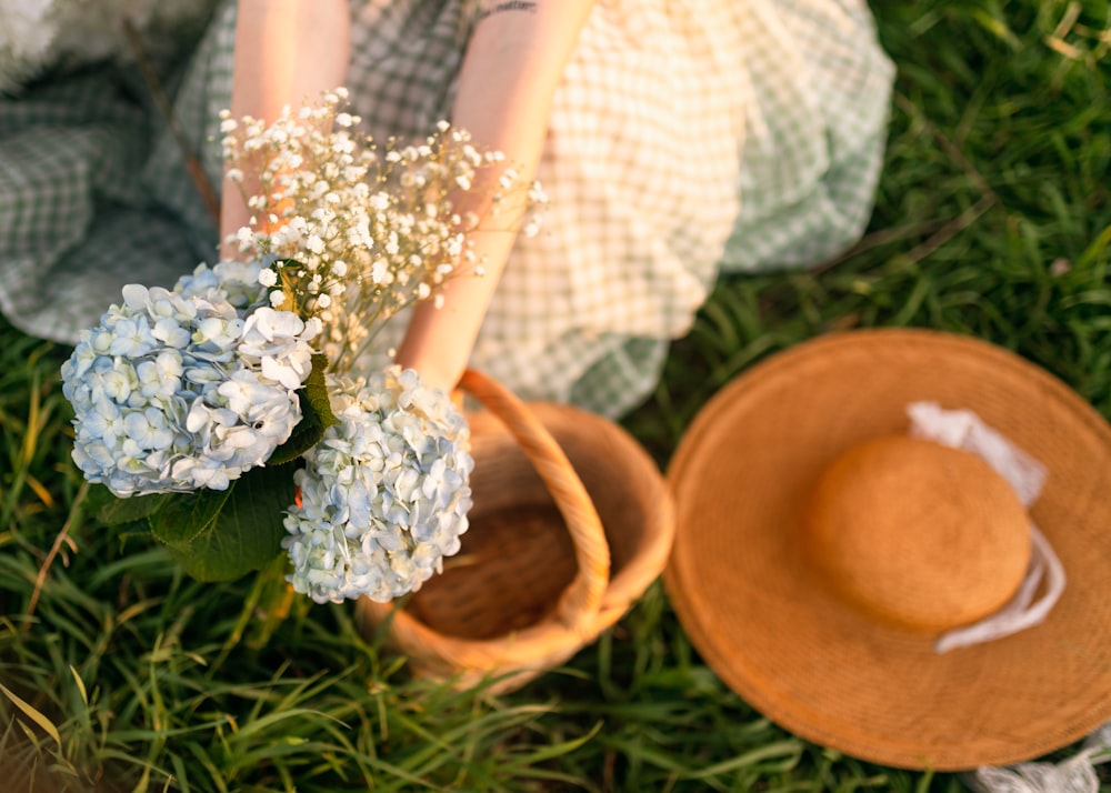 a person holding a bouquet of flowers in their hands