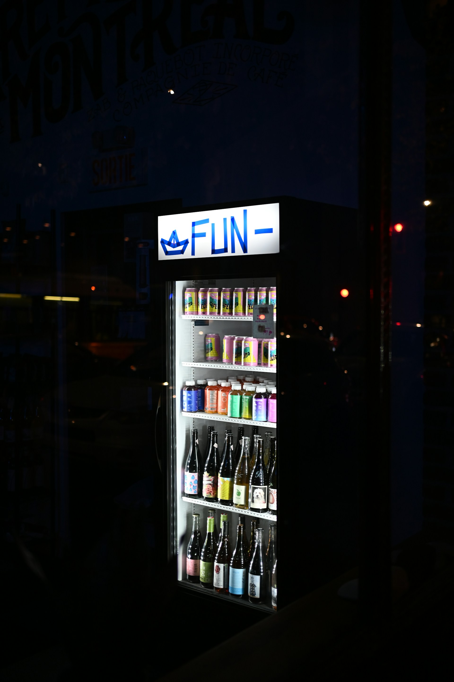 a vending machine is lit up at night