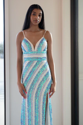 Chic formal dress in deep navy with subtle shimmer, worn with stylish heels.