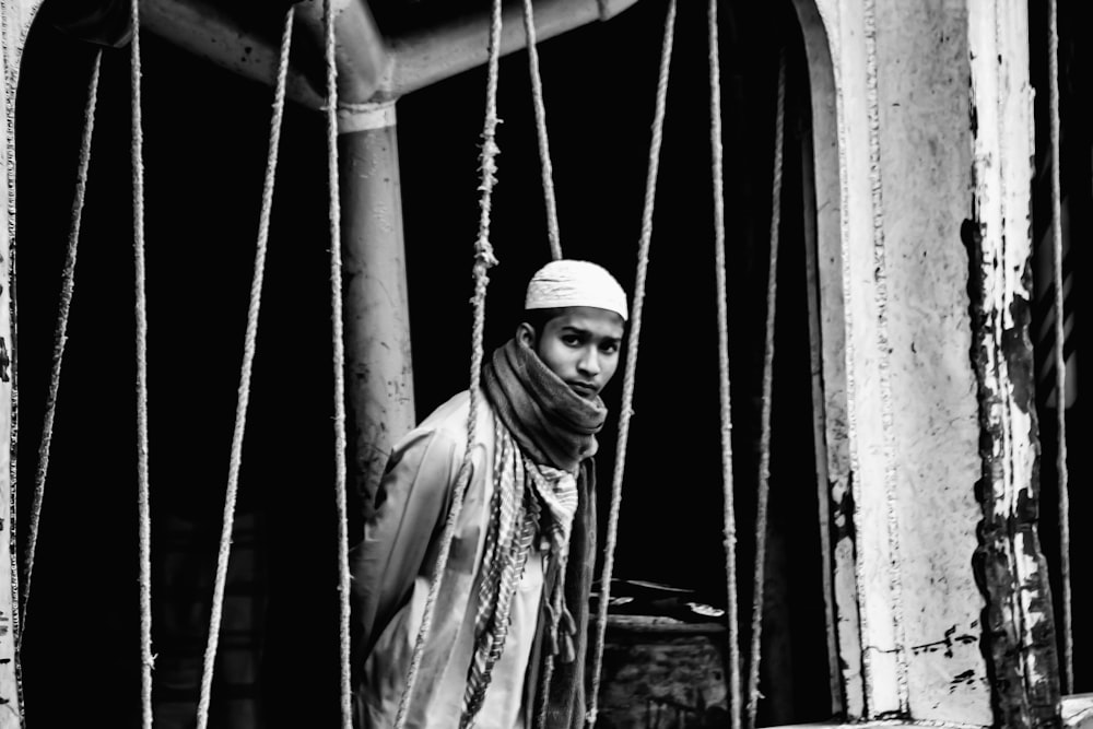 a black and white photo of a man in a turban