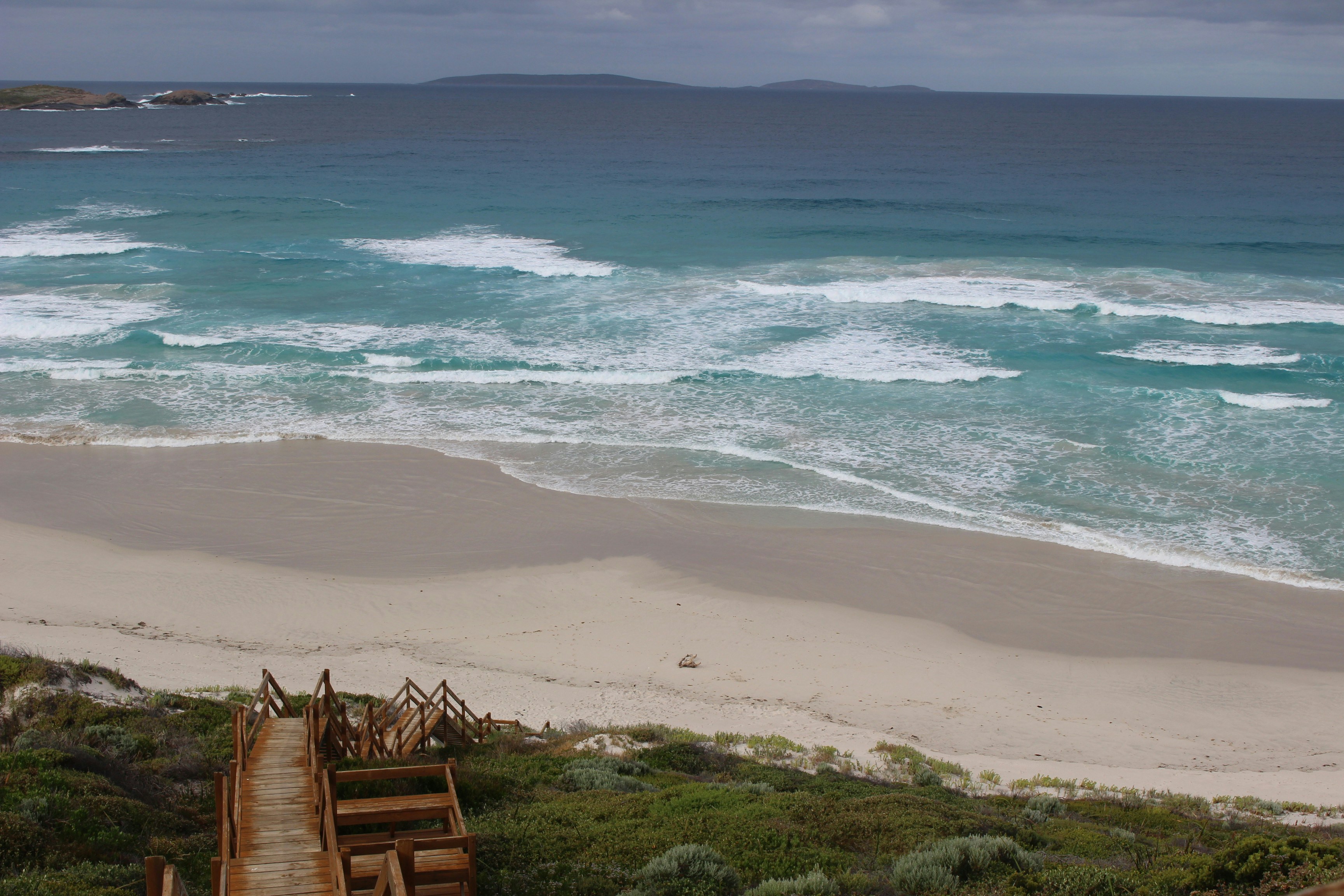 a staircase leading down to the beach