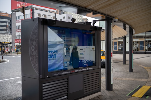 Modern outdoor digital signboard reflecting city architecture