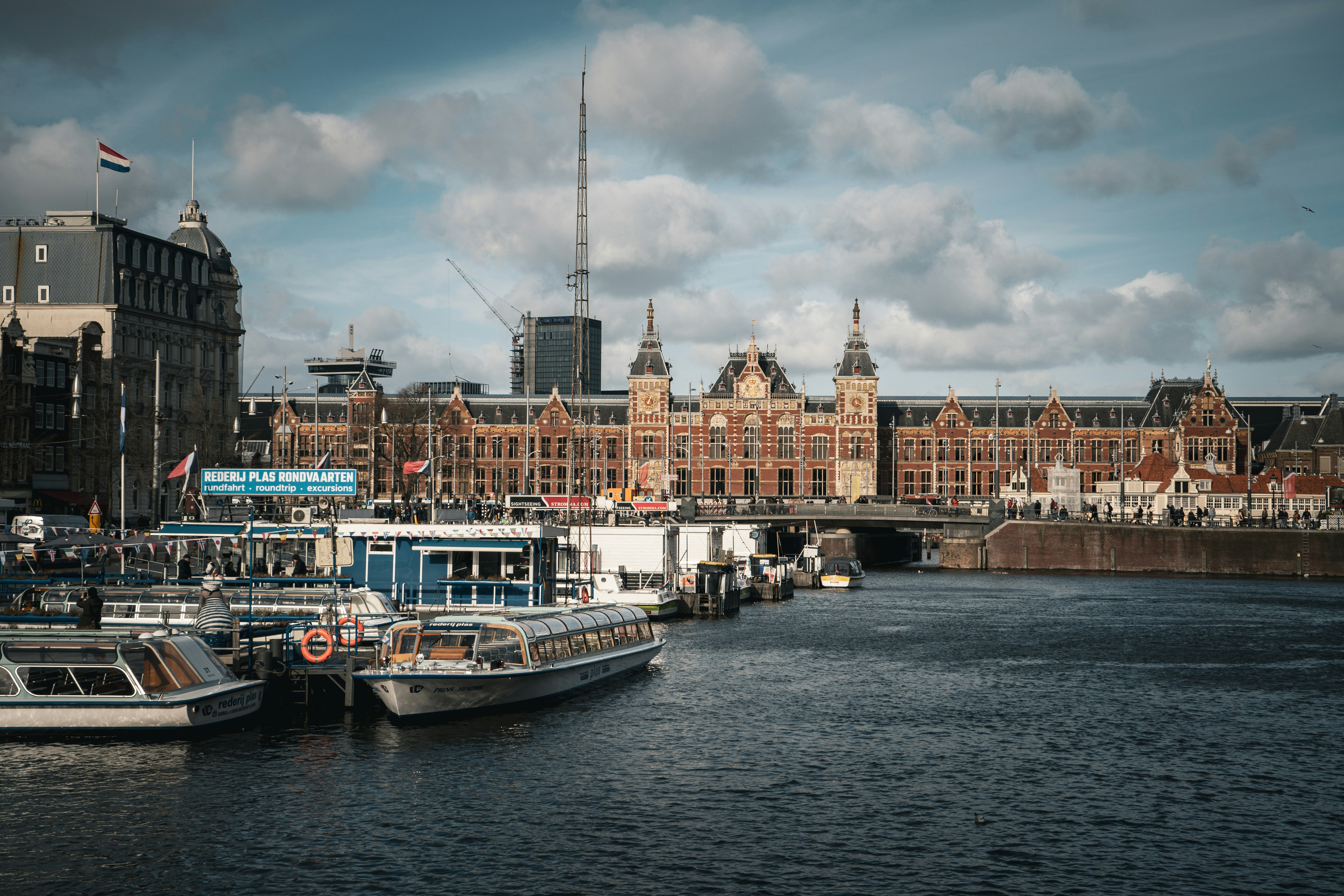 a group of boats that are sitting in the water
