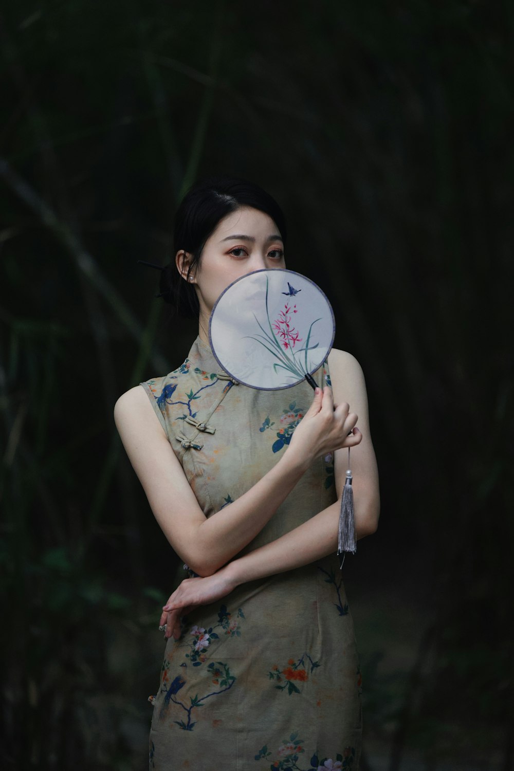 a woman with a fan in her hand