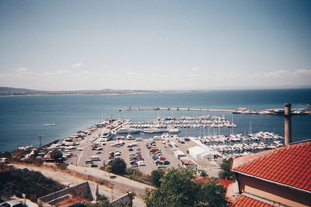 a harbor filled with lots of boats on top of a body of water