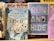 Two books are displayed side by side on a wooden surface. The book on the left, titled 'Fool for Love' by Deborah Moggach, features a cover with illustrated birds flying over a building set against a sky-blue and white striped background. The book on the right, titled 'Run and Hide' by Pankaj Mishra, has a blue cover with large white letters and an image of a small figure walking towards snowy mountains.