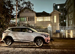 A ufirst medical solutions delivery van parked outside a hospital entrance during early morning.