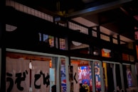 Colorful posters of Japanese culture and language tips decorating the bright classroom walls.