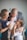 a man and two women holding a baby