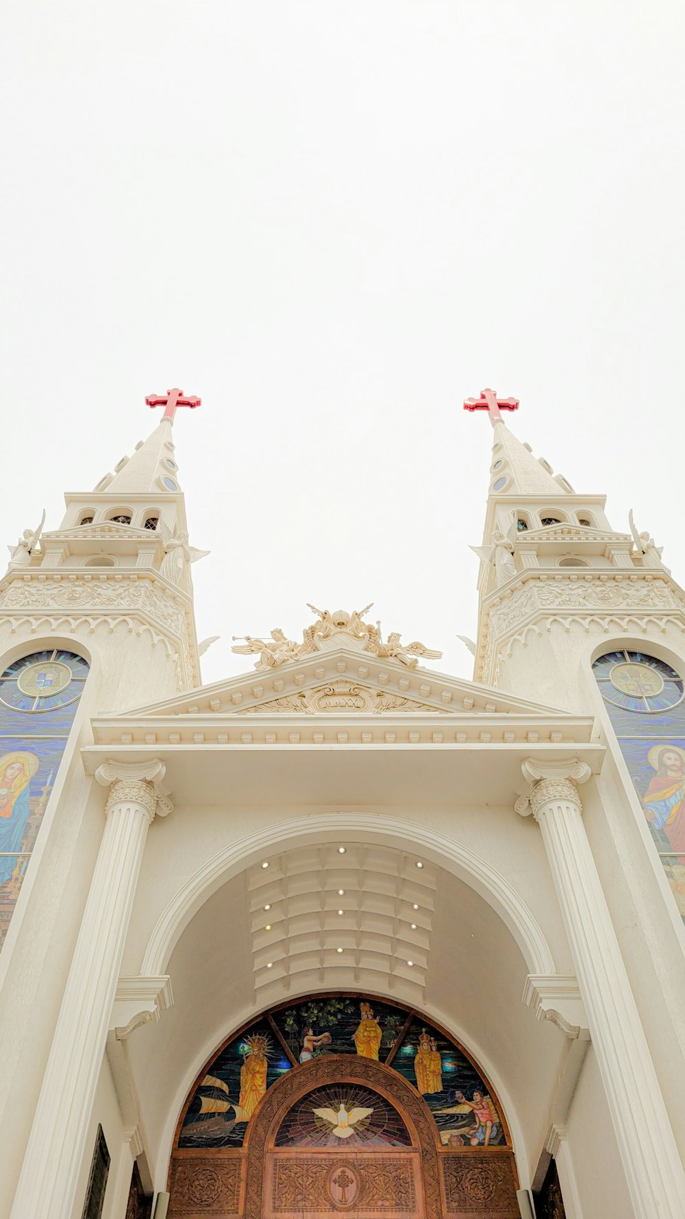 a large church with a clock on the front of it